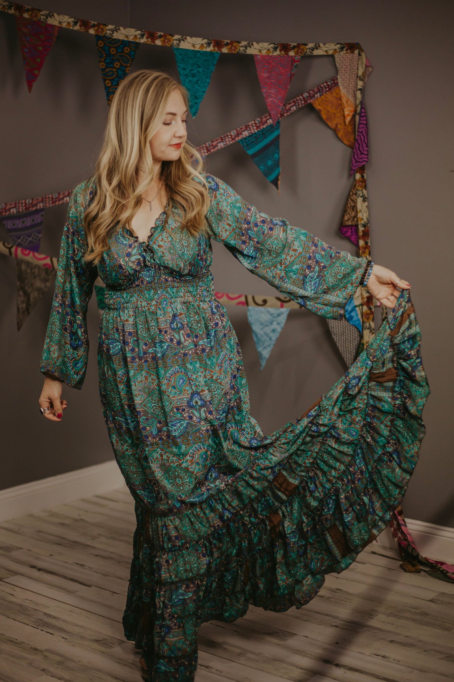 Woman wearing a teal and brown maxi dress